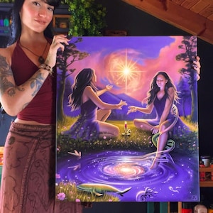 May include: A vibrant painting depicts two figures in purple dresses seated near a swirling galaxy and a glowing light. The artwork features a purple, pink, and orange color palette, with a whale and candle adding detail to the scene.