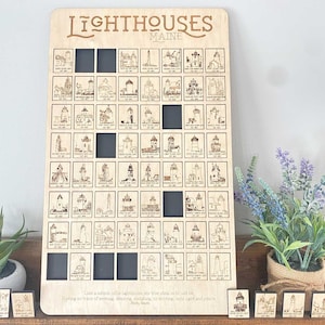 May include: A wooden board with a grid of 64 squares, each containing a black and white illustration of a lighthouse. The board is titled "Lighthouses Maine".