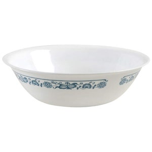 May include: A white ceramic bowl with a blue floral design around the rim.