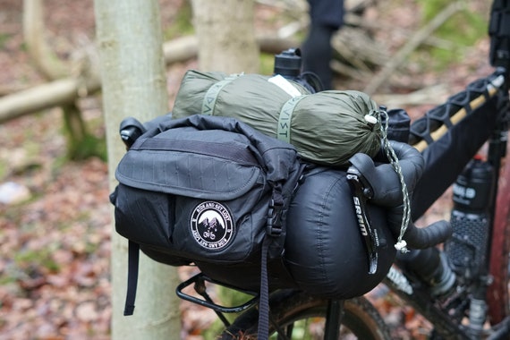 Bikepacking handlebar harness outlet