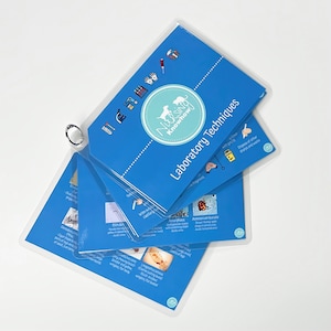 May include: A blue and white Nursing Knowhow guide with a ring binder. The guide features a variety of laboratory techniques, including a section on Amorphous and Ammonium burate.