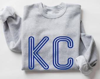 KC blauwe gesloten lijnen ronde hals | KC blauw T-shirt met gesloten lijnen | KC blauw T-shirt met lange mouwen en gesloten lijnen