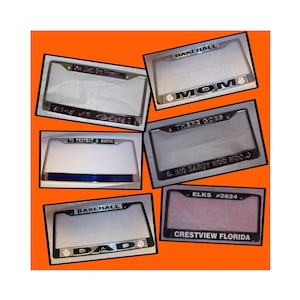 May include: A collection of 9 different license plate frames with various designs and text. The frames are silver and black with white backgrounds. The text includes "Baseball", "Mom", "There Goes", "Big Daddy Woo Woo", "Elks #2624", "Crestview Florida", "Dad", "To Protect & Serve", and "You Just Got Passed".