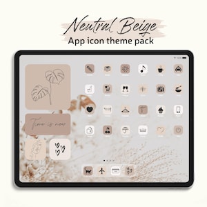 Könnte beinhalten: Ein digitales Tablet, das ein beiges App-Symbol-Theme-Paket anzeigt. Der Bildschirm zeigt verschiedene Symbole in einer neutralen Farbpalette mit dem Text "Neutral Beige" und "App icon theme pack" oben. Einige Symbole umfassen einen Bleistift, ein Buch, eine Sonne und eine Musiknote.