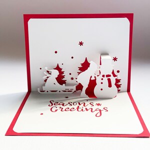 Plantilla digital Tarjeta navideña emergente, alegría navideña, juegos de invierno, muñeco de nieve, SVG, bricolaje, descarga instantánea