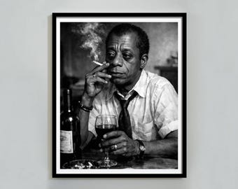 May include: Black and white framed print of a man holding a lit cigarette and a glass of red wine. A wine bottle and a small dish are on the table. The man is wearing a white shirt and a dark tie. The image is a portrait.