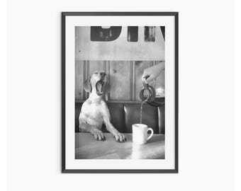 May include: Black and white framed print featuring a yawning dog seated at a diner table. A hand pours liquid from a metal pitcher into a white mug. The dog's mouth is wide open, and the scene evokes a humorous, sleepy atmosphere.