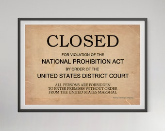 May include: A framed print featuring a vintage-style tan paper background with black text that reads: CLOSED FOR VIOLATION OF THE NATIONAL PROHIBITION ACT BY ORDER OF THE UNITED STATES DISTRICT COURT. ALL PERSONS ARE FORBIDDEN TO ENTER PREMISES.