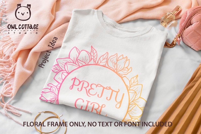 May include: A white t-shirt featuring a floral design and the text "PRETTY GIRL" in a pink and orange gradient. The floral design is a circle of magnolia flowers and leaves.