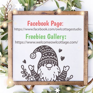 May include: A white sign with a brown wooden frame, featuring a cartoon gnome with a red hat and a white background. The sign includes the text "Facebook Page: https://www.facebook.com/owlcottagestudio" and "Freebies Gallery: https://www.welcomeowlcottage.com/"