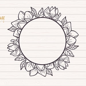 May include: Black and white line drawing of a circle frame with magnolia flowers and leaves. The frame is on a white wood background. The text "OWL COTTAGE STUDIO" is at the top of the image.