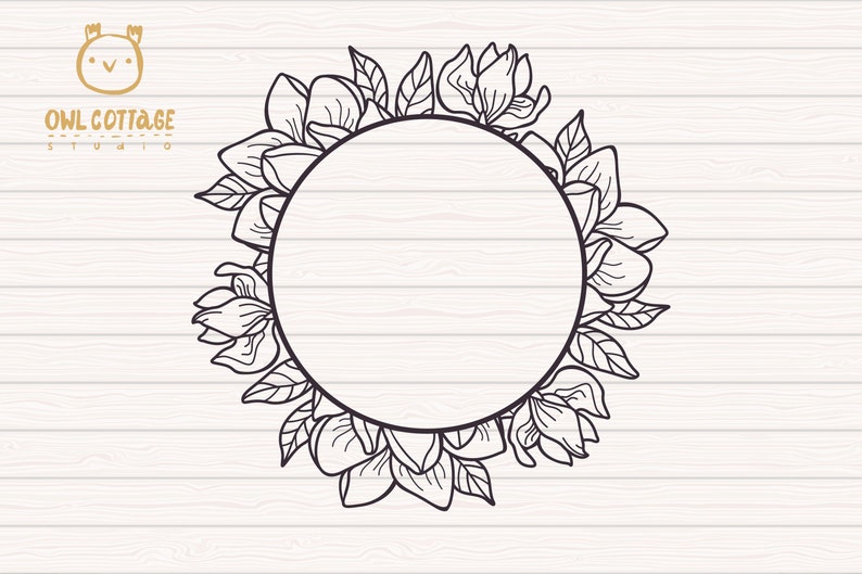 May include: Black and white line drawing of a circle frame with magnolia flowers and leaves. The frame is on a white wood background. The text "OWL COTTAGE STUDIO" is at the top of the image.