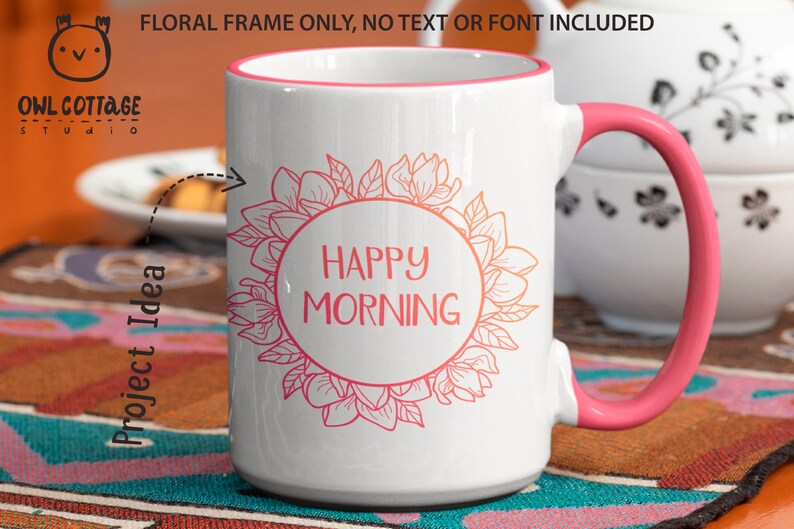 May include: White ceramic mug with a pink rim and handle. The mug features a floral design with a circle in the centre that says "HAPPY MORNING".