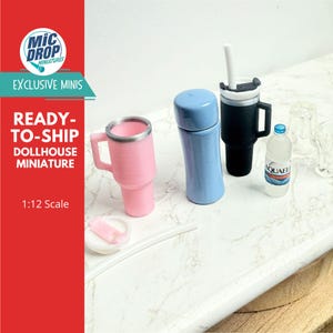 May include: Miniature dollhouse drinkware set including a pink tumbler, a blue thermos, a black travel mug with a white straw, and a small water bottle. The set is labeled "Mic Drop Miniatures" and "Ready-to-Ship Dollhouse Miniature."