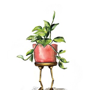May include: A watercolor painting of a potted plant with green leaves. The pot is pink and has gold legs shaped like chicken feet.