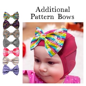 May include: A set of 10 colorful patterned bows for babies. The bows are made of fabric and have a variety of designs, including polka dots, stripes, and rainbows. The bows are shown on a white background.