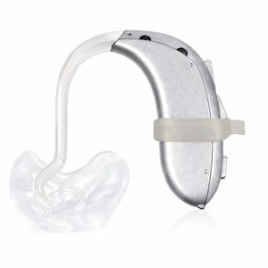 May include: A silver hearing aid with a clear plastic ear mold and tubing. The hearing aid has a curved design and a small, clear plastic band. The ear mold is designed to fit inside the ear.