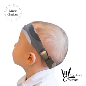 May include: A baby wearing a grey and camouflage patterned headband with a beige sensor. The headband is secured with a dark green adjustable strap. The image includes the text "More Choices" and the logo "Little Gates Creations."