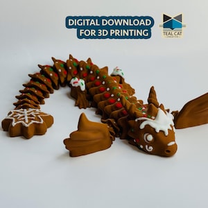 May include: A gingerbread dragon with red and green icing, white frosting, and a snowflake design. The dragon is posed with its wings spread out and its tail curled up. This is a 3D printable model.