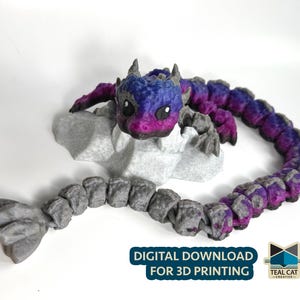 May include: A 3D-printed dragon figurine in shades of blue, purple, and pink, perched on a gray rock formation. The dragon's body is segmented, and the image includes the text "DIGITAL DOWNLOAD FOR 3D PRINTING".