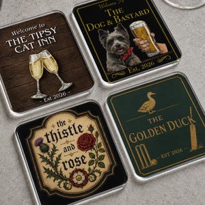 May include: Four square coasters with rounded corners. One features The Tipsy Cat Inn with champagne glasses, another shows The Dog & Bastard with a dog and beer, one displays The Thistle and Rose with floral art, and one shows The Golden Duck with cricket gear.