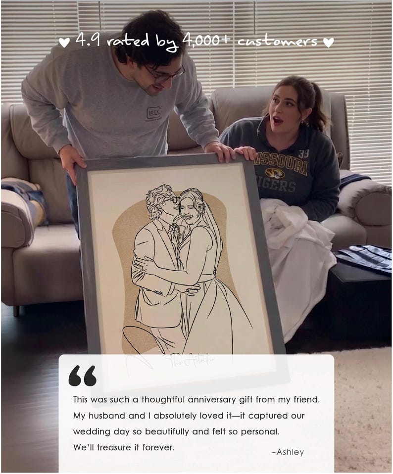 May include: A framed line art portrait of a couple in wedding attire, featuring a black outline drawing on a tan background. The artwork is encased in a grey frame and includes the text 4.9 rated by 4,000+ customers and a testimonial quote.