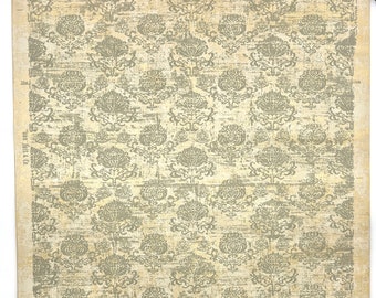 May include: A vintage wallpaper roll with a repeating pattern of stylized floral motifs in a muted green color on a cream background. The wallpaper has a textured, distressed look.
