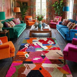 May include: A vibrant living room with a colorful rug, emerald green and blue sofas, and orange and pink armchairs. The room features patterned throw pillows, lamps, and a wooden coffee table with vases. The overall style is eclectic and bohemian.