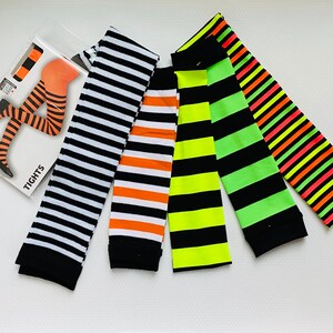May include: Five pairs of striped tights in black and white, orange and white, neon green and black, neon yellow and black, and pink and black.
