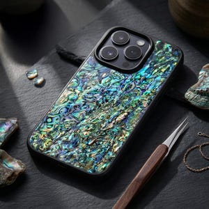 May include: A trio of ceramic mugs with a speckled, matte finish in light blue, cream, and grey. The mugs have a simple, modern design and a comfortable handle. Ideal for tea or coffee.