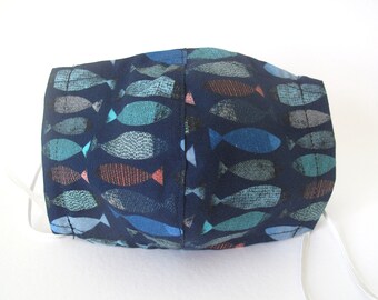 May include: A dark blue face mask with a repeating pattern of stylized fish in shades of blue, green, and red.
