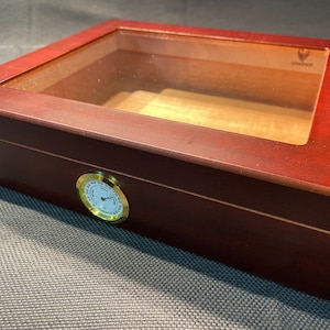 Elegant vintage wooden cigar humidor