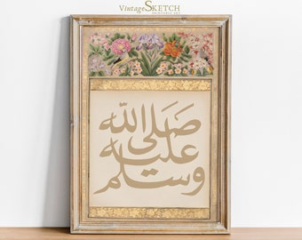 May include: A framed print with a gold frame and a white background. The print features a floral design with birds and the Arabic text "Allah" in gold lettering.