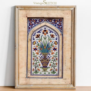Peut inclure: Une impression encadrée d'un motif de carrelage vintage représentant un vase de fleurs dans un schéma de couleurs bleu et jaune. Le carrelage est entouré d'une bordure décorative et placé sur un fond beige.
