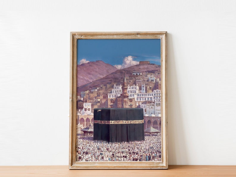 May include: A framed painting depicting the Kaaba, a cube-shaped building in Mecca, Saudi Arabia. The Kaaba is surrounded by a large crowd of people, and the painting also shows a view of the surrounding city and mountains.