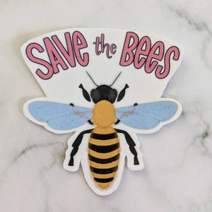 May include: A sticker with a bee illustration and the text "Save the Bees" in pink lettering.