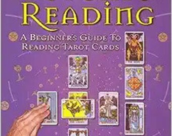 May include: A purple book titled "How to Perform a Psychic Reading: A Beginner's Guide to Reading Tarot Cards" by James Gregory. The cover features a hand holding tarot cards and a purple background with a pattern of small white stars.