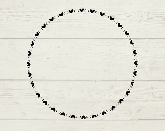 May include: A black and white graphic of a circle made of small hearts. The circle is on a woodgrain background.