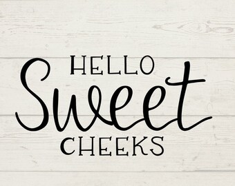 May include: Black and white text graphic design on a wood background. The text reads "HELLO Sweet CHEEKS".