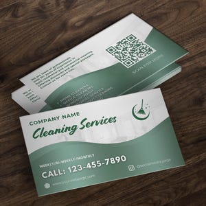 May include: Business cards for a cleaning service, featuring a green and white design. The cards display the company name, contact information, and a QR code. Services include home, office, and window cleaning.