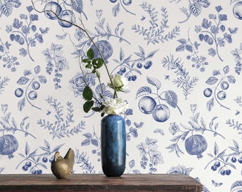 May include: A white background with a blue floral pattern featuring pomegranates, apples, and berries. A wooden table with a blue vase and a gold chicken figurine is in the foreground.