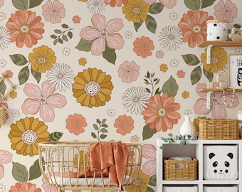 May include: A nursery room with a floral wallpaper featuring pink, yellow, and orange flowers. A wicker bassinet with a blanket is in the foreground. There are shelves with baskets and a panda-shaped storage bin.