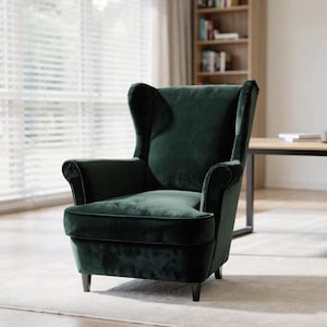 May include: A dark green velvet armchair with a high back and curved armrests. The chair has a classic wingback design and sits on four dark wooden legs. The chair is placed in front of a window with blinds.