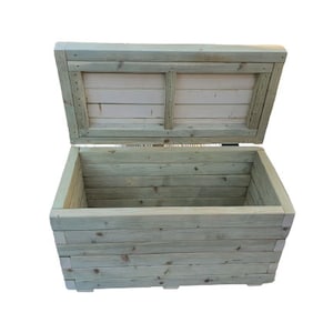May include: A wooden storage chest with a hinged lid, open to reveal the empty interior. The chest is made of light green wood planks and has a rustic appearance.