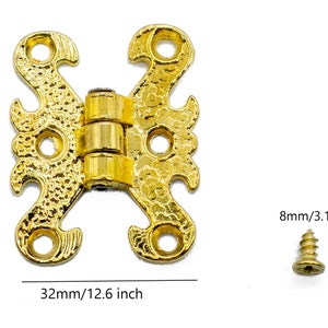 May include: Gold-toned decorative hinge with a detailed design. The hinge measures 1.6 inches in length and 1.26 inches in width. It comes with a small gold-toned screw.