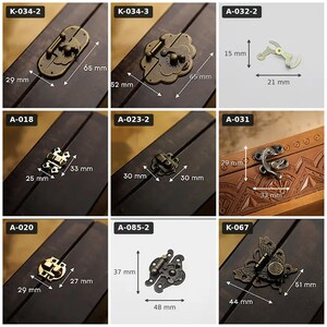 May include: A collection of eight metal box latches and hinges in various shapes and antique bronze finishes. Each item is labeled with a code and includes visible metric measurements, such as 65 mm by 29 mm, 15 mm by 21 mm, and 37 mm by 48 mm.