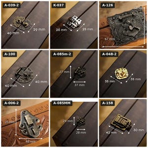 May include: A collection of nine metal box latches and clasps in various antique bronze, silver, and gold finishes. Each item is labeled with a code and includes dimensions in millimeters, such as 40 mm by 29 mm, 26 mm by 25 mm, and 67 mm by 58 mm.