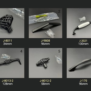 May include: Six different black cabinet knobs and pulls with varying designs and sizes. The knobs and pulls are displayed on a gray background. The measurements are listed below each item. J-8011 34mm, J-9808 96mm, J-2021 130mm, J-8013-2 128mm, J-8012-2 58mm, J-170 96mm.
