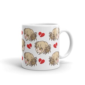 May include: White ceramic mug with a repeating pattern of a cartoon character with blonde hair and a broken heart. The character has a frustrated expression.