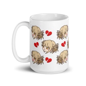 May include: White ceramic mug with a repeating pattern of a cartoon character with blonde hair and a red broken heart. The character has a frustrated expression.